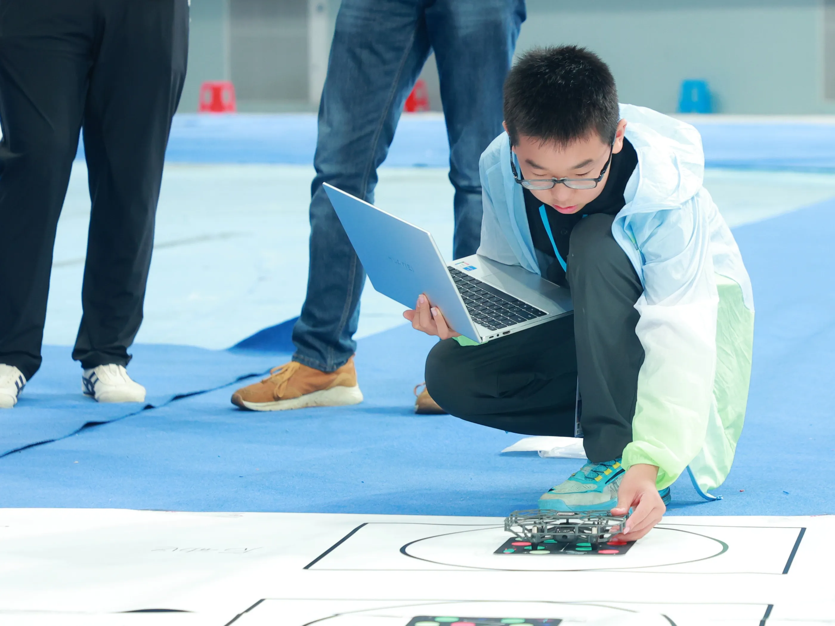 A student starting their drone